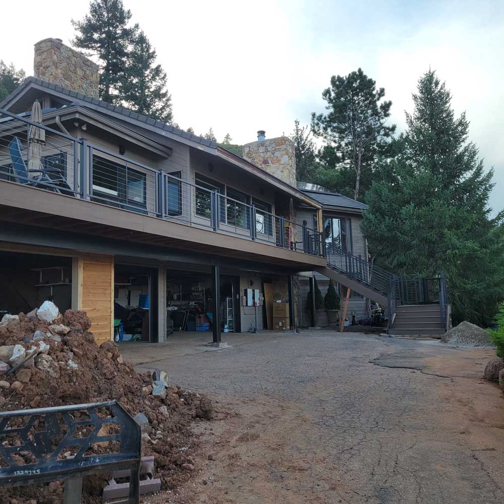Raised deck with metal cable railing — deck build by BH Builders, Denver metro