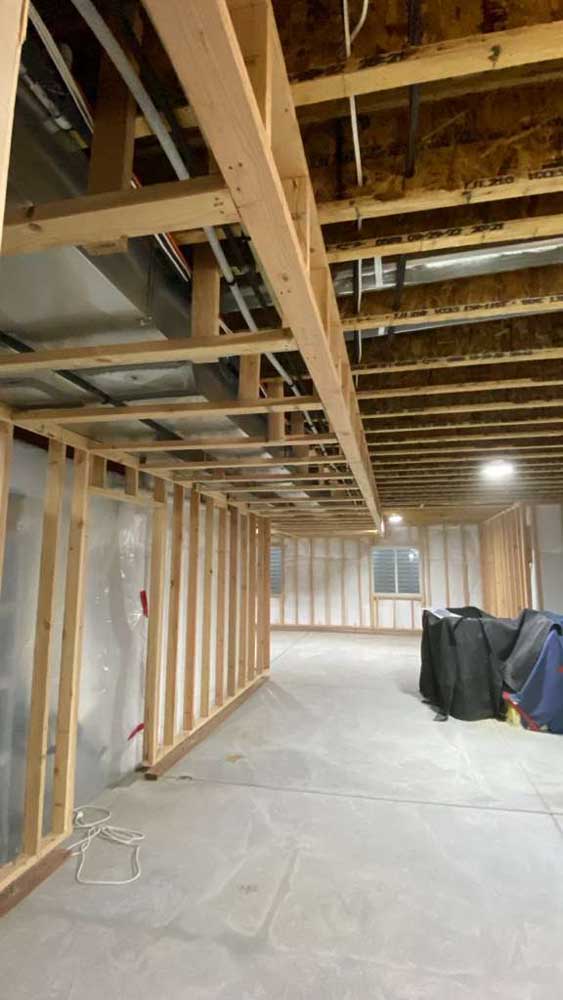 Basement framing wood stud walls floor joists — basement finishing project by BH Builders, Denver metro
