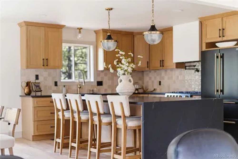 Kitchen remodel maple cabinets dark island stools — kitchen remodel by BH Builders, Denver metro
