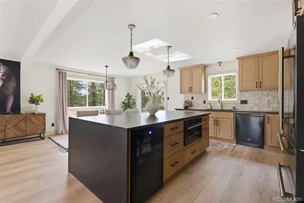 Kitchen remodel natural wood cabinets black island — kitchen remodel by BH Builders, Denver metro