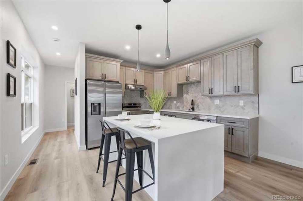 Kitchen remodel taupe cabinets white quartz island — kitchen remodel by BH Builders, Denver metro