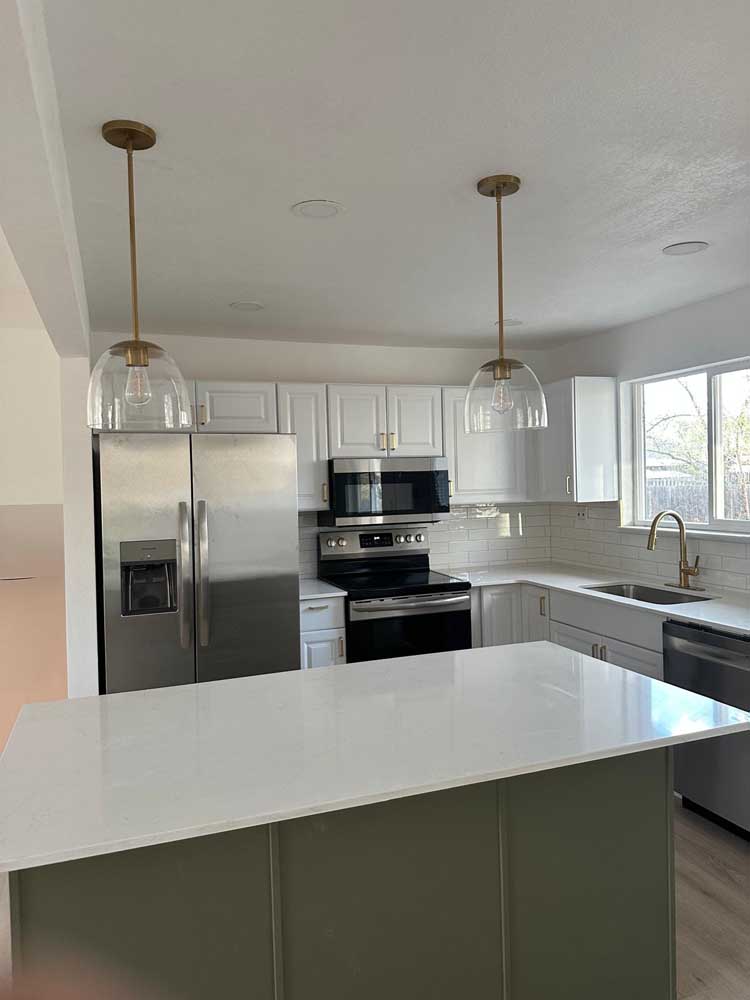 Kitchen remodel white cabinets green island — kitchen remodel by BH Builders, Denver metro
