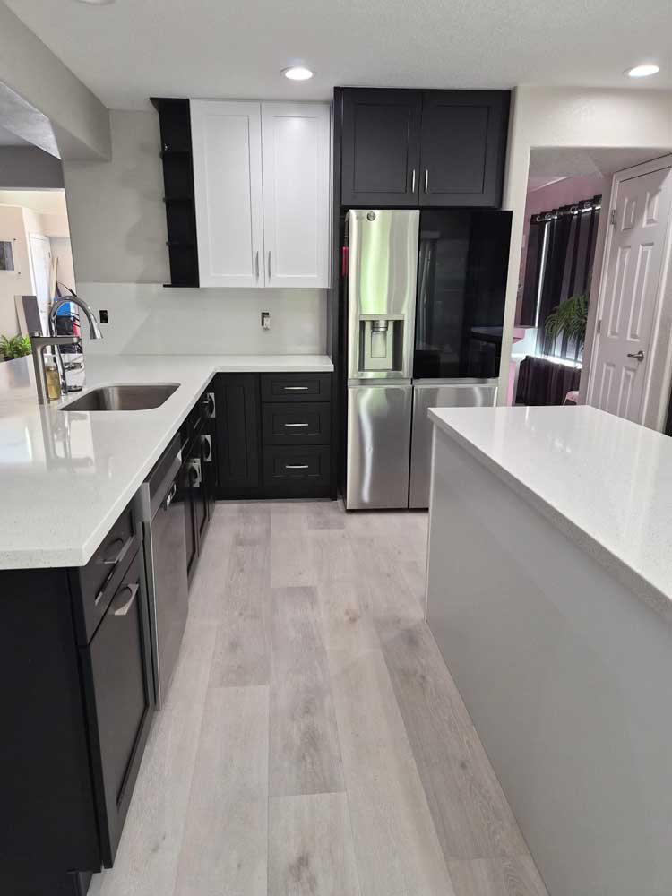 Two tone black white kitchen quartz countertops — kitchen remodel by BH Builders, Denver metro