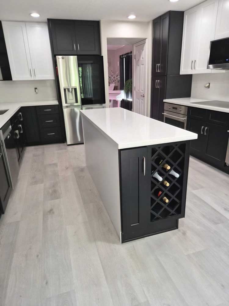 Two tone kitchen black cabinets white island wine rack — kitchen remodel by BH Builders, Denver metro