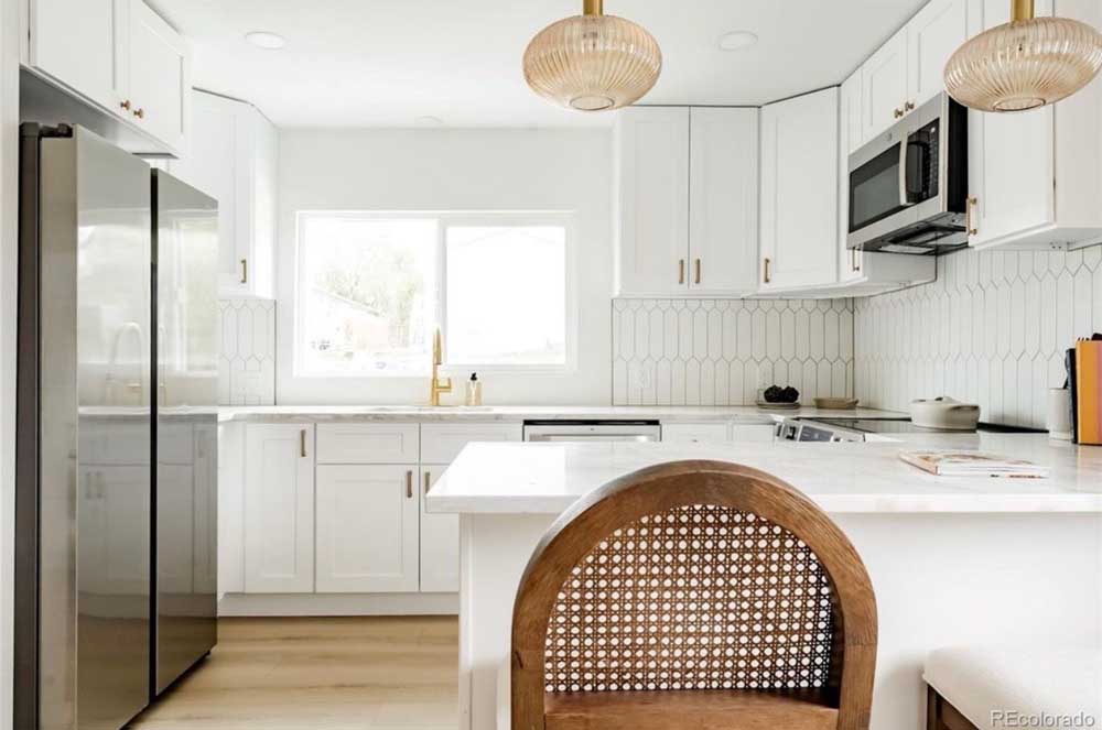 White kitchen marble countertops picket tile backsplash — kitchen remodel by BH Builders, Denver metro